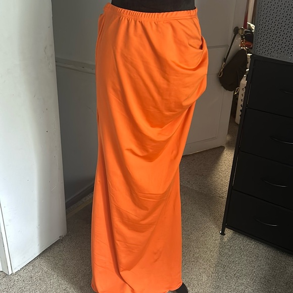 Dresses & Skirts - Orange long skirt with a gathered detail on the side hip. Body hugging style.